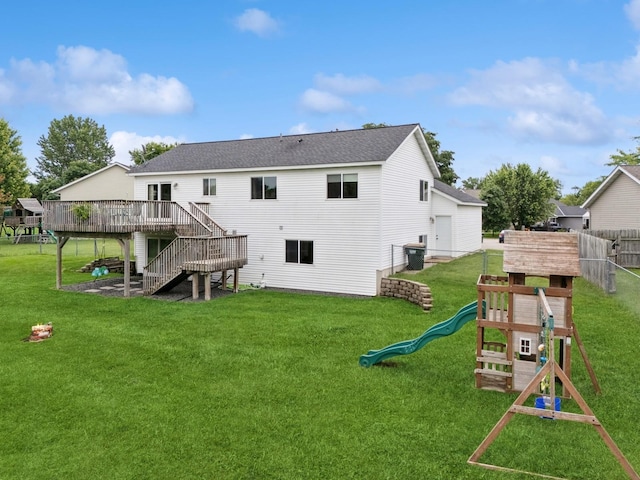 853 Texas Ct NW, Hutchinson, MN 55350 - rear view of house with stairway, a wooden deck, a playground, and a shingled roof