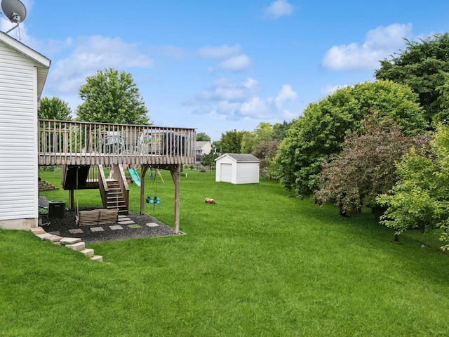 853 Texas Ct NW, Hutchinson, MN 55350 - view of green lawn featuring a shed, a wooden deck, and stairway