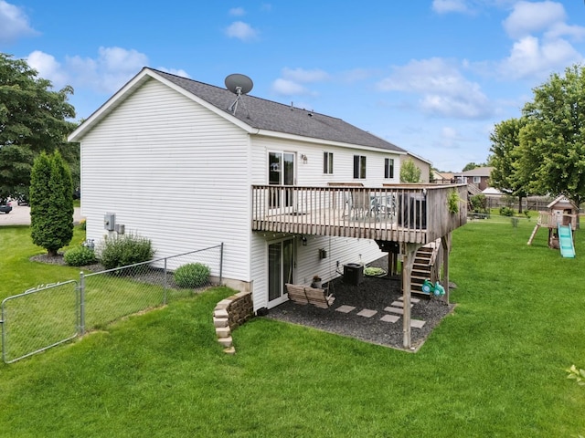 853 Texas Ct NW, Hutchinson, MN 55350 - back of property with a wooden deck, stairs, a fenced backyard, and a playground