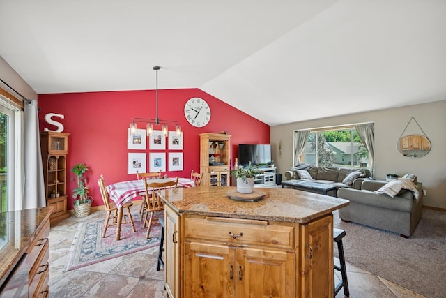853 Texas Ct NW, Hutchinson, MN 55350 - kitchen featuring a breakfast bar, vaulted ceiling, a center island, light stone counters, and open floor plan