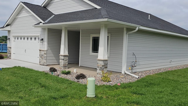 3104 Zuni St, Anoka, MN 55303 - view of home's exterior with covered porch, roof with shingles, a lawn, a garage, and driveway