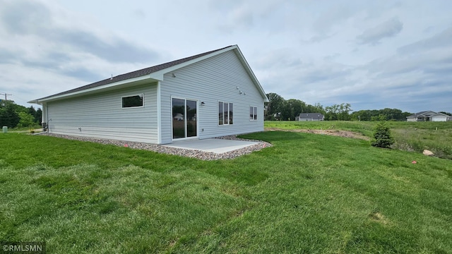 3104 Zuni St, Anoka, MN 55303 - back of property featuring a patio area and a yard