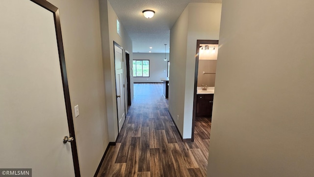 3104 Zuni St, Anoka, MN 55303 - corridor with dark wood-style floors and a textured ceiling