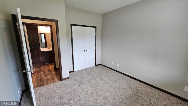 3104 Zuni St, Anoka, MN 55303 - unfurnished bedroom featuring dark colored carpet and a closet