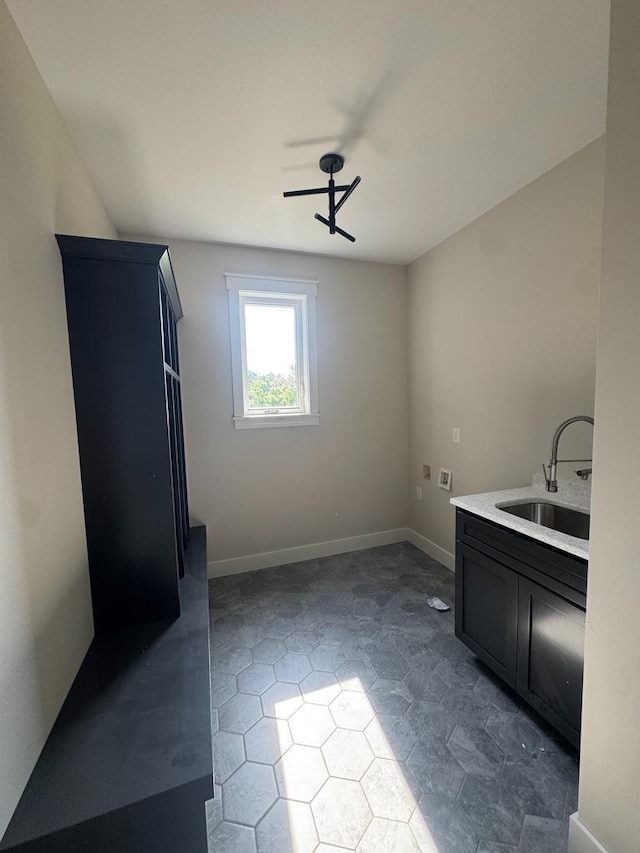 1945 Spruce Meadows Dr SE, Rochester, MN 55904 - washroom featuring dark tile patterned floors and washer hookup