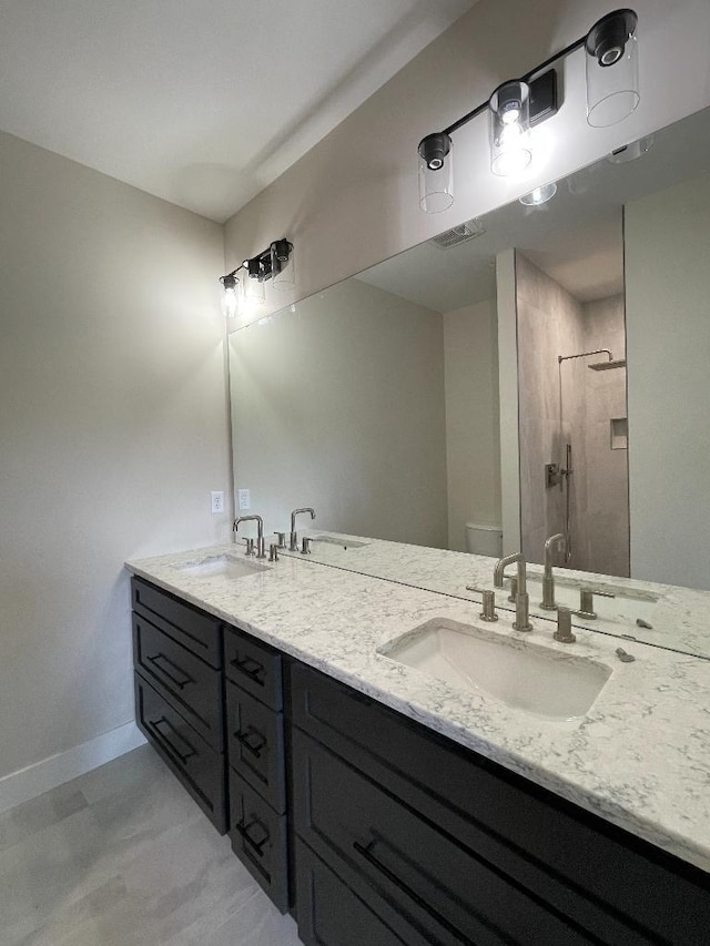 1945 Spruce Meadows Dr SE, Rochester, MN 55904 - full bath with double vanity and a walk in shower