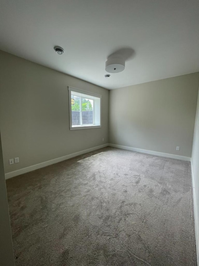 1945 Spruce Meadows Dr SE, Rochester, MN 55904 - spare room featuring carpet floors and baseboards