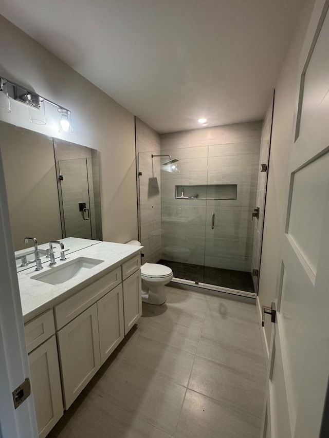 1945 Spruce Meadows Dr SE, Rochester, MN 55904 - bathroom with vanity, a stall shower, and recessed lighting