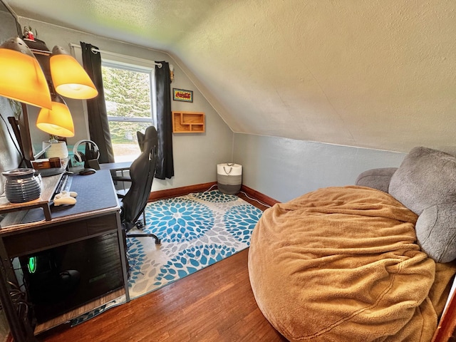 420 7th St, Marshall, MN 56258 - home office with a textured ceiling, wood finished floors, and lofted ceiling
