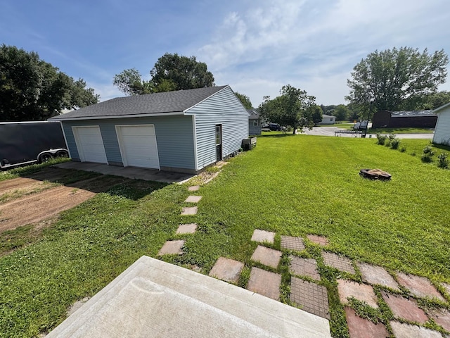420 7th St, Marshall, MN 56258 - view of green lawn with an outbuilding and a detached garage