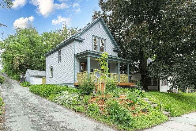 1112 29th Ave NE, Minneapolis, MN 55418 - view of front facade with a porch and an outbuilding