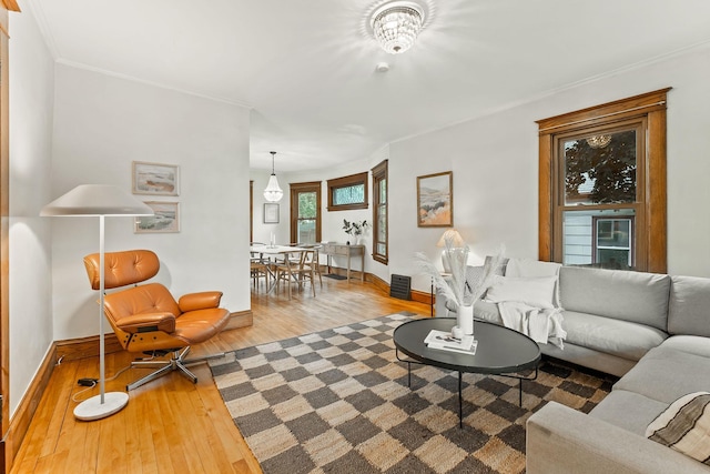 1112 29th Ave NE, Minneapolis, MN 55418 - living room with hardwood / wood-style floors and crown molding