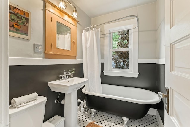 1112 29th Ave NE, Minneapolis, MN 55418 - full bath with a freestanding tub, tile patterned floors, and curtained shower