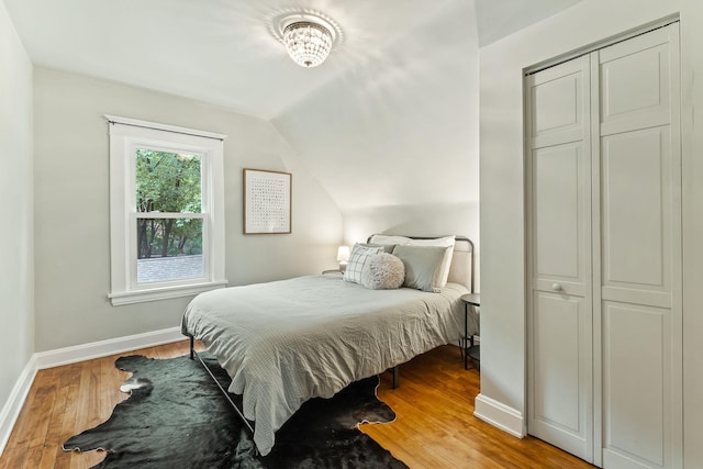 1112 29th Ave NE, Minneapolis, MN 55418 - bedroom featuring hardwood / wood-style flooring and lofted ceiling