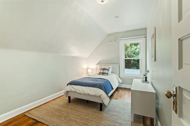 1112 29th Ave NE, Minneapolis, MN 55418 - bedroom with wood finished floors and vaulted ceiling