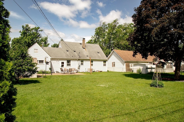 8029 2nd Ave S, Bloomington, MN 55420 - back of property with a patio area, a chimney, and roof with shingles