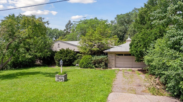 1065 Colby St, Saint Paul, MN 55116 - view of front facade with a front yard and a garage