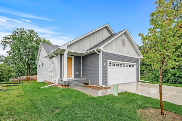 201 Mccarrons Pl W, Roseville, MN 55113 - view of front facade with board and batten siding, driveway, a garage, and a shingled roof