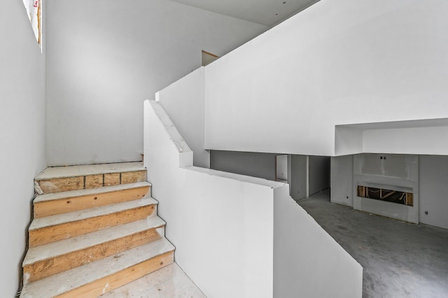 201 Mccarrons Pl W, Roseville, MN 55113 - stairs featuring concrete flooring and a fireplace