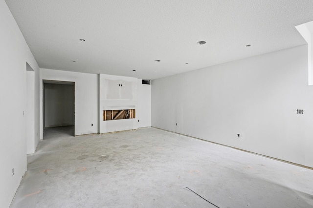 201 Mccarrons Pl W, Roseville, MN 55113 - unfurnished living room with concrete flooring and a fireplace