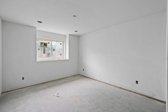 201 Mccarrons Pl W, Roseville, MN 55113 - empty room featuring unfinished concrete flooring and a textured ceiling