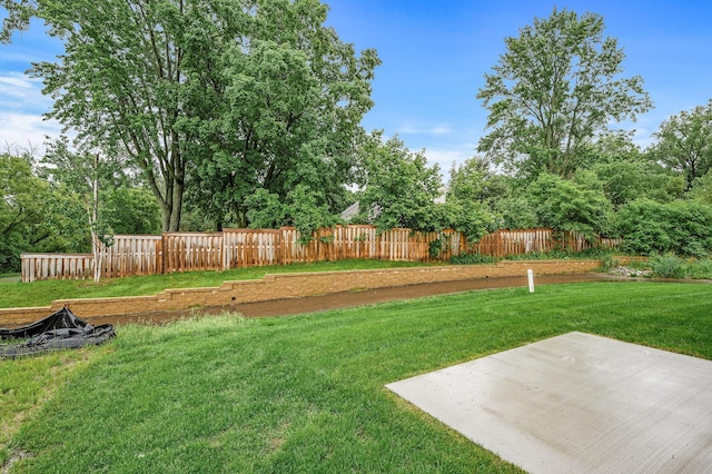 201 Mccarrons Pl W, Roseville, MN 55113 - view of yard with a patio and view of wooded area