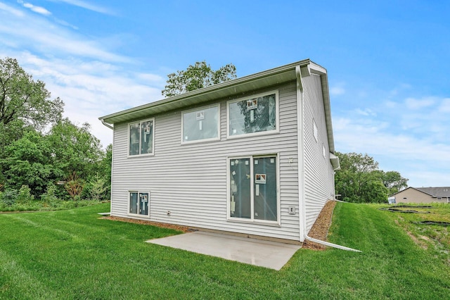 201 Mccarrons Pl W, Roseville, MN 55113 - back of house featuring a lawn and a patio area