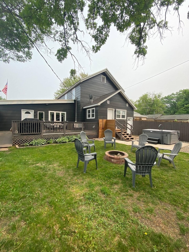 116 3rd Ave, Crosby, MN 56441 - back of house with a hot tub, an outdoor fire pit, and a deck