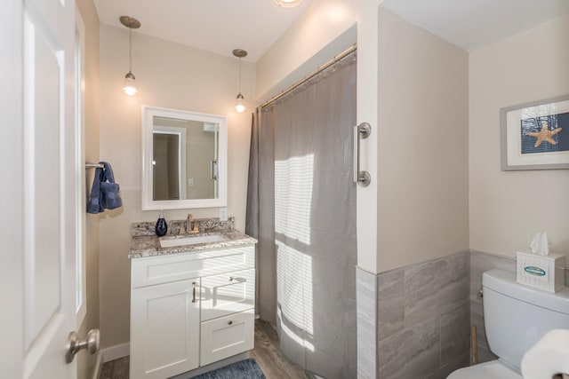 116 3rd Ave, Crosby, MN 56441 - bathroom featuring vanity, a shower with curtain, and tile walls