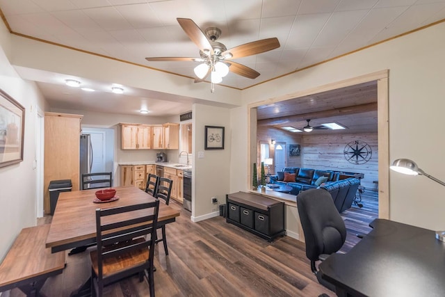 116 3rd Ave, Crosby, MN 56441 - dining space featuring ceiling fan, wooden walls, dark wood-type flooring, an accent wall, and ornamental molding