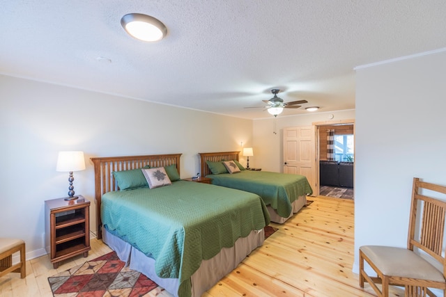 116 3rd Ave, Crosby, MN 56441 - bedroom featuring wood finished floors, a textured ceiling, and a ceiling fan