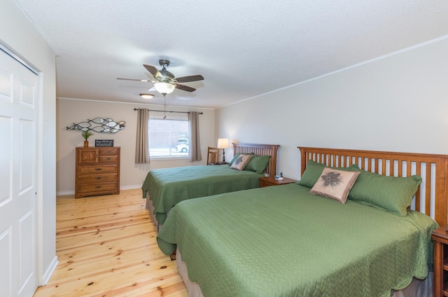116 3rd Ave, Crosby, MN 56441 - bedroom featuring light wood-style flooring, ceiling fan, ornamental molding, and a textured ceiling