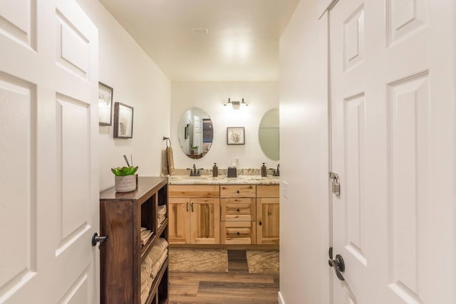 116 3rd Ave, Crosby, MN 56441 - bathroom with wood finished floors and double vanity