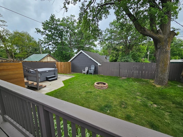 116 3rd Ave, Crosby, MN 56441 - fenced backyard with a hot tub and an outdoor fire pit