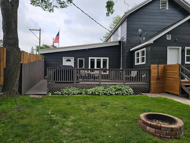 116 3rd Ave, Crosby, MN 56441 - rear view of house with a wooden deck and a fire pit