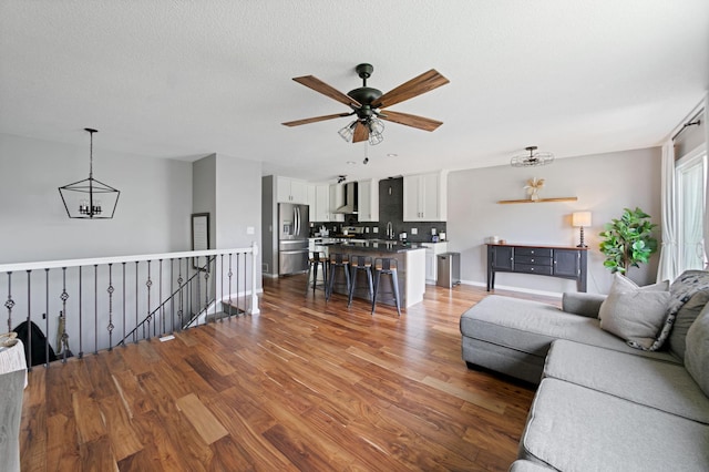 3576 Avon Ct, Woodbury, MN 55125 - living area featuring ceiling fan, wood finished floors, and a textured ceiling