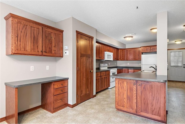 641 Lake St N, Big Lake, MN 55309 - kitchen with white appliances, dark countertops, a textured ceiling, and brown cabinetry