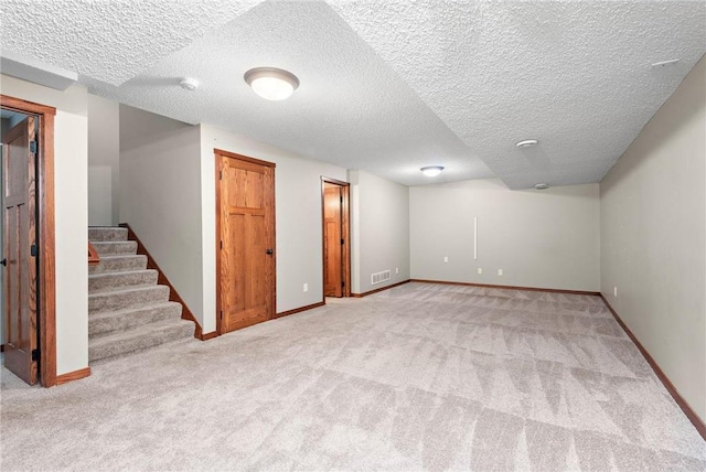 641 Lake St N, Big Lake, MN 55309 - finished below grade area featuring carpet floors, stairs, and a textured ceiling