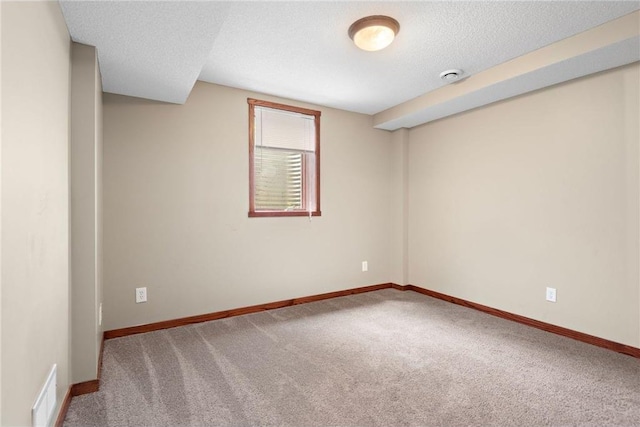 641 Lake St N, Big Lake, MN 55309 - carpeted empty room featuring a smoke detector and a textured ceiling