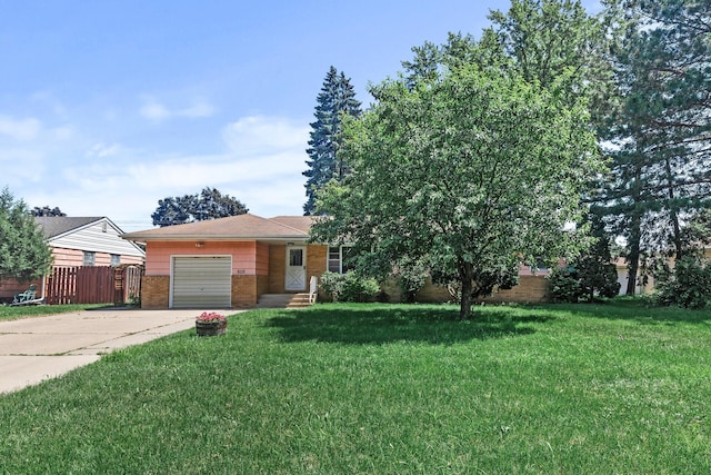 6112 Kyle Ave N, Brooklyn Center, MN 55429 - view of front of property with brick siding, an attached garage, and concrete driveway