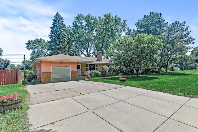 6112 Kyle Ave N, Brooklyn Center, MN 55429 - ranch-style home with brick siding, concrete driveway, an attached garage, and a chimney