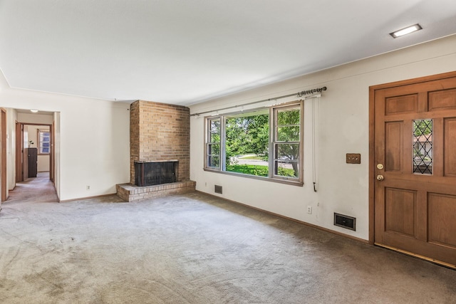 6112 Kyle Ave N, Brooklyn Center, MN 55429 - unfurnished living room featuring carpet flooring and a fireplace