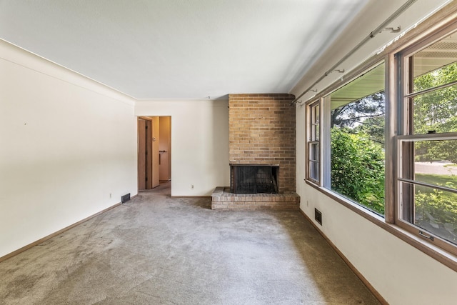 6112 Kyle Ave N, Brooklyn Center, MN 55429 - unfurnished living room with a brick fireplace and carpet