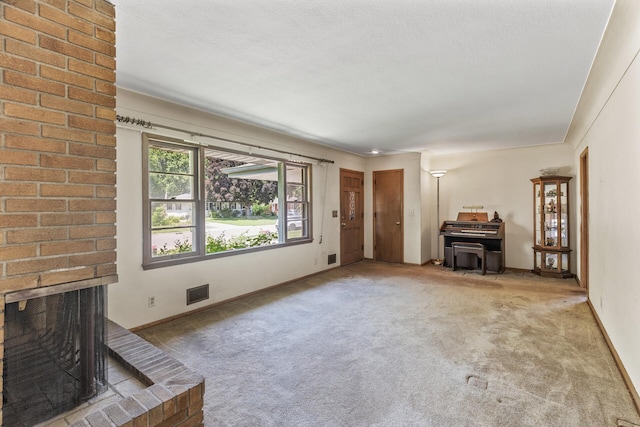 6112 Kyle Ave N, Brooklyn Center, MN 55429 - unfurnished living room featuring carpet floors, a brick fireplace, and a wood stove