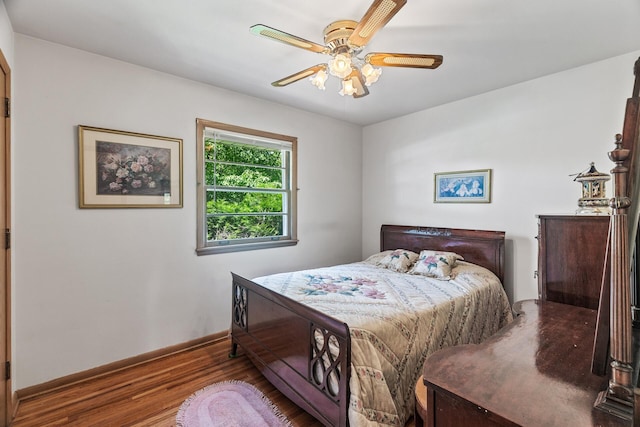 6112 Kyle Ave N, Brooklyn Center, MN 55429 - bedroom featuring wood finished floors and ceiling fan