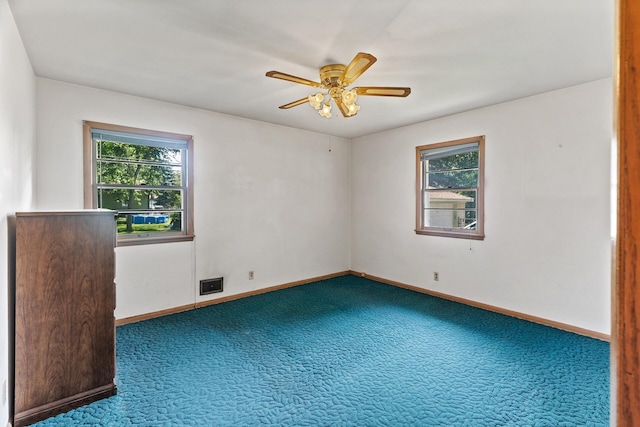 6112 Kyle Ave N, Brooklyn Center, MN 55429 - unfurnished room with carpet flooring and ceiling fan