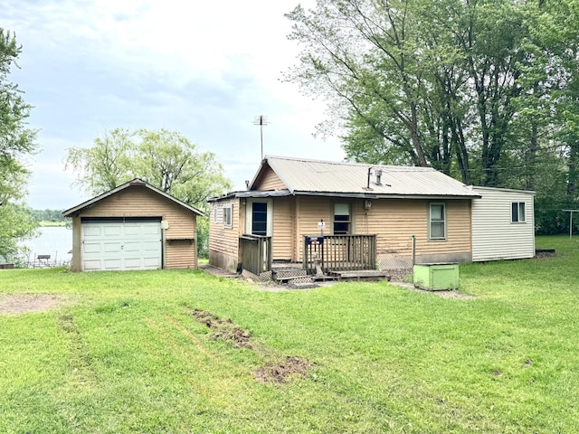 92354 Lake 12 Rd, Windemere Twp, MN 55783 - rear view of property with a garage, an outdoor structure, a yard, and a deck