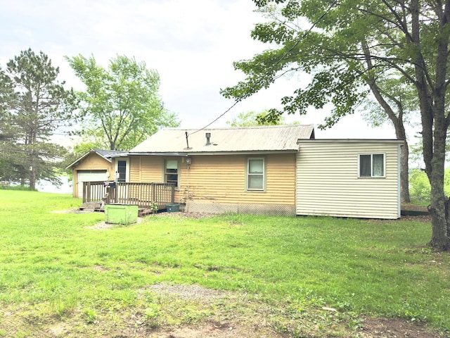 92354 Lake 12 Rd, Windemere Twp, MN 55783 - back of house with a lawn and a metal roof