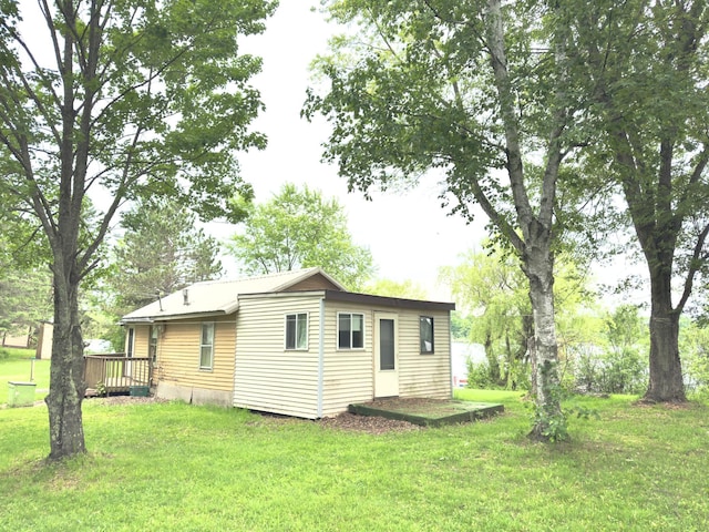 92354 Lake 12 Rd, Windemere Twp, MN 55783 - back of house featuring a lawn and a wooden deck