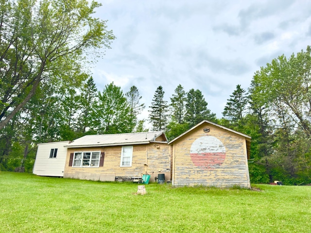 92354 Lake 12 Rd, Windemere Twp, MN 55783 - back of house with a lawn